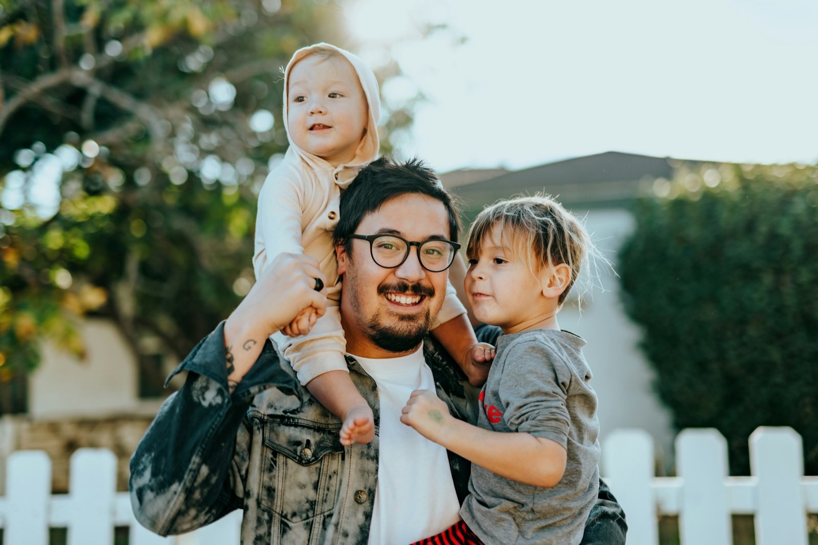 Father spending time outdoors with his two children